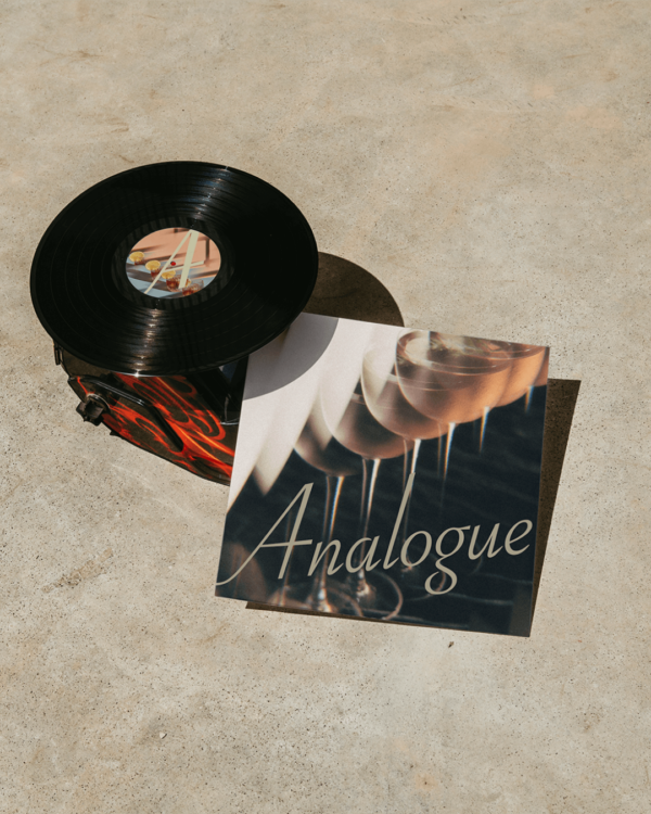 A mockup of a Analogue logo on the cover of a vinyl record.