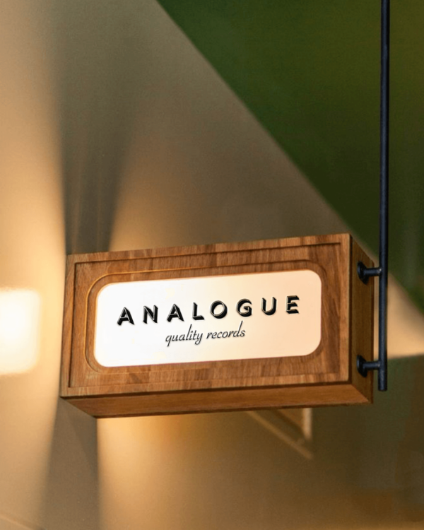 A mockup of the Analogue logo on a lit sign.