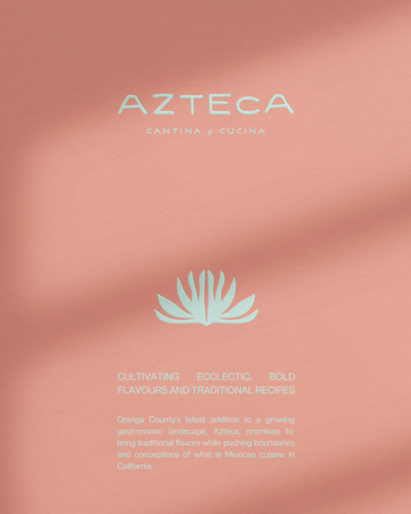 A stationary mockup of the Azteca logo and brand style on a salmon color background with soft shadows.